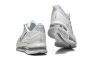 Rear and outsole views of the white and silver Nike Pegasus Premium shoes.
