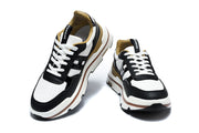 Pair of black and white low-top sneakers shown from front and top angles.