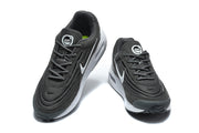 Pair of black Nike Air Max Verse sneakers shown from above and the front.