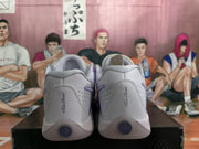 Rear view of the sneakers showing perforated heel panels and Team Dancer lettering