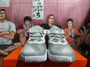 Front view of white and silver Nike basketball shoes