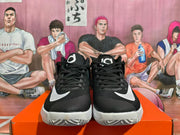 Front view of the pair of black and white Nike basketball shoes with lace-up fronts.