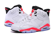 Close side view of the pair showing perforated panels, white laces, black collars, and bright red midsole accents.