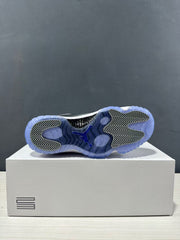 Outsole view showing the translucent blue rubber outsole and patterned traction sections.
