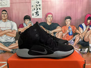 Side view of a black Nike Hyperdunk basketball shoe with grey midsole and Swoosh