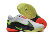 Nike 908-2 sneakers displayed with their patterned lime and coral outsoles visible.