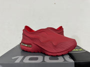 Burgundy Nike slip-on sneaker shown from the lateral front angle on a shoe box.
