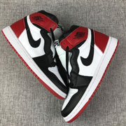 Pair of Air Jordan 1 high-top sneakers showing the black, white, and red colorway