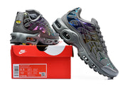 Nike Air Max Plus sneakers beside a box label showing model, style code, and a size 42 EU sample