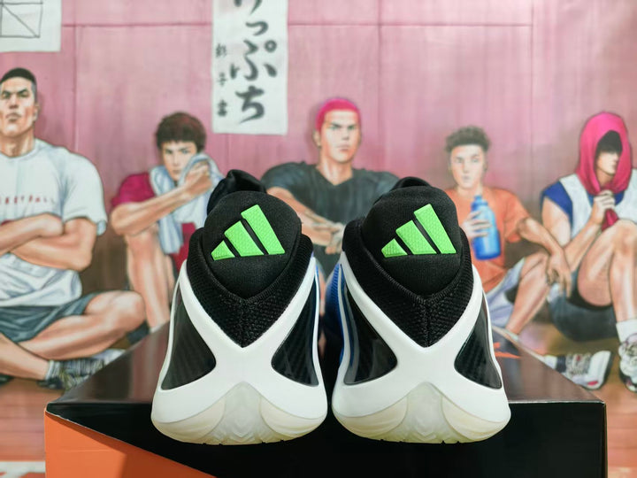 Rear view of black basketball shoes with white heel overlays and bright volt adidas tongue logos.