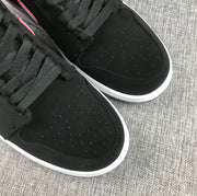 Detailed view of the perforated black toe boxes, black laces and white midsoles.