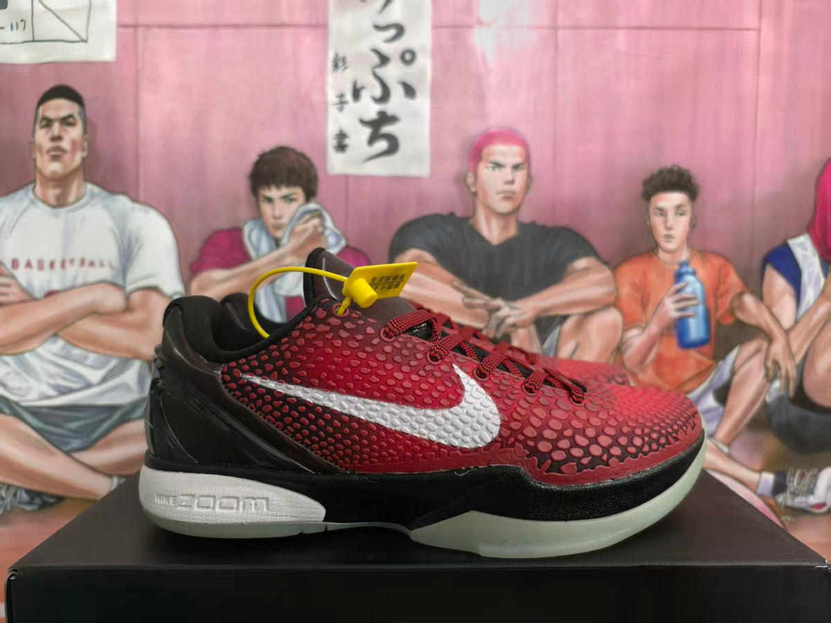 Side view of black and red Nike Zoom basketball sneakers with textured red uppers and light-colored side branding.