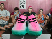 Front view showing pink gradient uppers, black laces, and mint-green soles