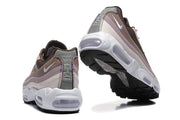 Rear and outsole views of Nike sneakers showing heel details and visible Air units.