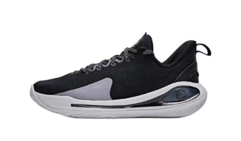 Side view of a black and gray low-top sneaker with laces and a light-colored sole.