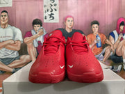 Front view of red basketball shoes showing perforated toes and lace-up closure