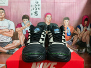 Front view of the pair showing black laces, padded tongues with Air and Ndestrukt markings, and textured toe sections.