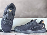 Nike Kobe 8 shoes in top and side views, showing the tongue emblem and laces
