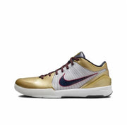 Gold and white Kobe 4 basketball sneaker with dark red and navy accents.
