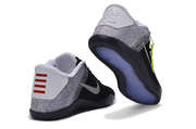 Black and white basketball shoes shown from the heel and outsole