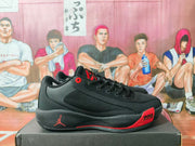 Side profile showing the black and red sneaker, Jordan logo, red outsole detail, and visible Air Zoom text.