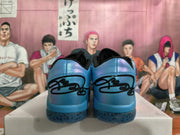 Rear view of iridescent blue Nike basketball shoes with black heel details and patterned translucent outsoles