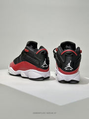 Rear three-quarter view showing the padded collars, ankle details, and visible AIR branding.