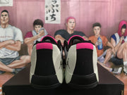 Rear view showing black heel panels, light side sections, and pink collar accents