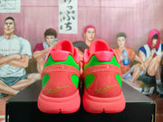 Rear view of coral and green Nike Kobe PE basketball shoes