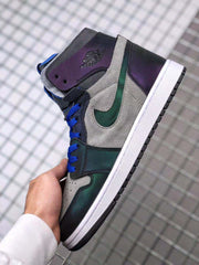Side close-up showing the gray upper, dark iridescent ankle and forefoot panels, green Swoosh area and white midsole.