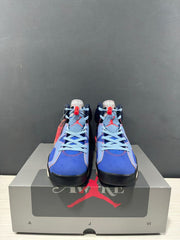 Front view showing the blue toe panels, light-blue laces, navy collars, and red details.