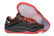 Black Nike KD 16 shoes with bright red accents and a patterned outsole.