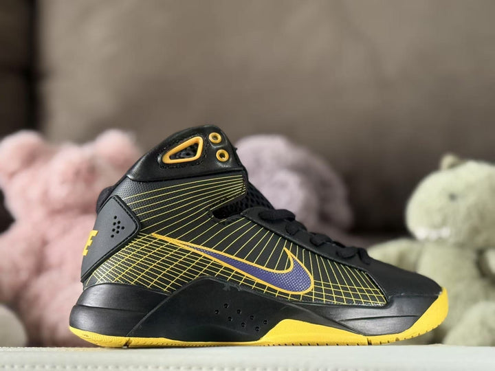 Side view of black and yellow Nike Kobe HD2008 high-top sneakers with a patterned upper and purple Swoosh.