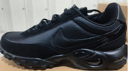 Side profile of a black Nike Air Max Waffle SP sneaker.