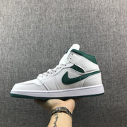 Lateral side view of the white sneaker with green Swoosh and outsole.