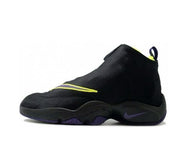 Black Nike Payton basketball sneaker with yellow detailing, purple Swoosh, and purple outsole accents.