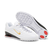 White and gold Nike Shox Z R2 sneakers with the outsole visible