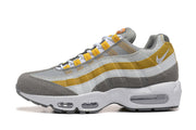 Side profile of a grey, white and yellow Nike Air Max 95 TT sneaker.
