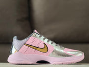 Opposite side profile highlighting perforated pink panels, metallic silver overlays and the pink midsole.