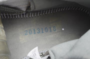 Close-up of the inside of a sneaker showing a blue printed code.