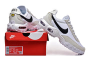 Nike Air Max Waffle SP sneakers in white and grey shown on a red Nike box; the box label is visible.