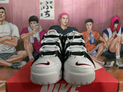 Front view showing the white toe boxes, black upper panels, white laces, and small red swoosh details.