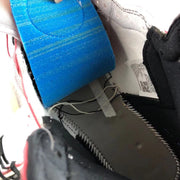 Close-up of the sneaker interior, insole and attached product label.