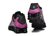 Rear and outsole views of the purple and black Nike Shox TL sneakers.