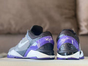 Rear view showing the purple heel sections and contrasting black and white midsoles.