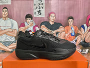 Side view of a black Nike basketball sneaker showing the tonal Swoosh, lace-up construction, and textured outsole.