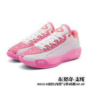 Pair of pink and white Jordan 8812 basketball shoes in a front three-quarter view.