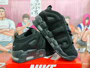 Angled view of black Nike basketball sneakers showing mesh panels and the heel Air unit