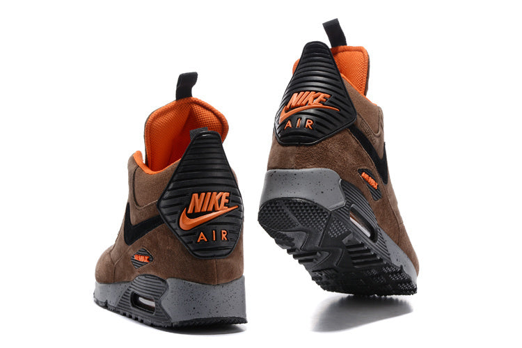 Rear views of brown Nike Air Max 90 Winter Sneakerboot high-tops with black and orange accents.