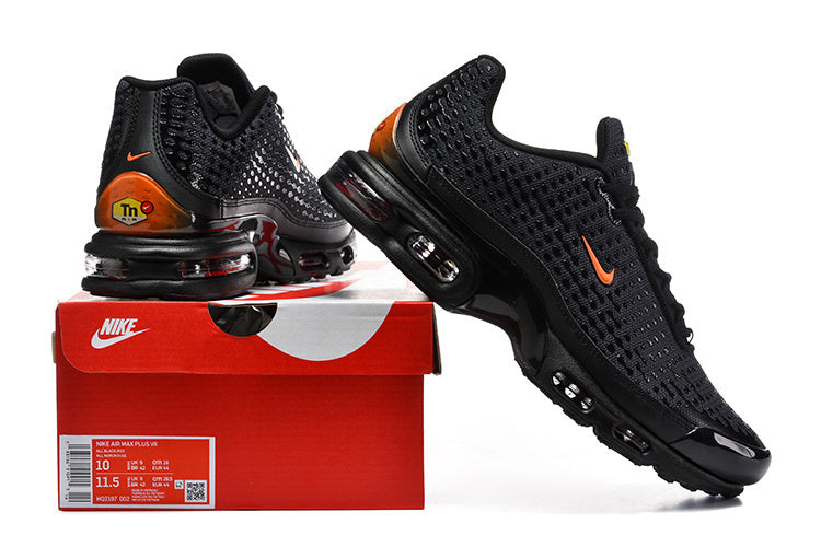 Black and orange Nike Air Max Plus VII sneakers displayed with a box showing a size label